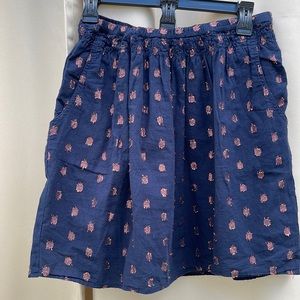 J. Crew navy skirt with rose gold pattern